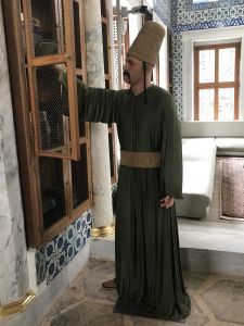 Another holy man at his bookcase...